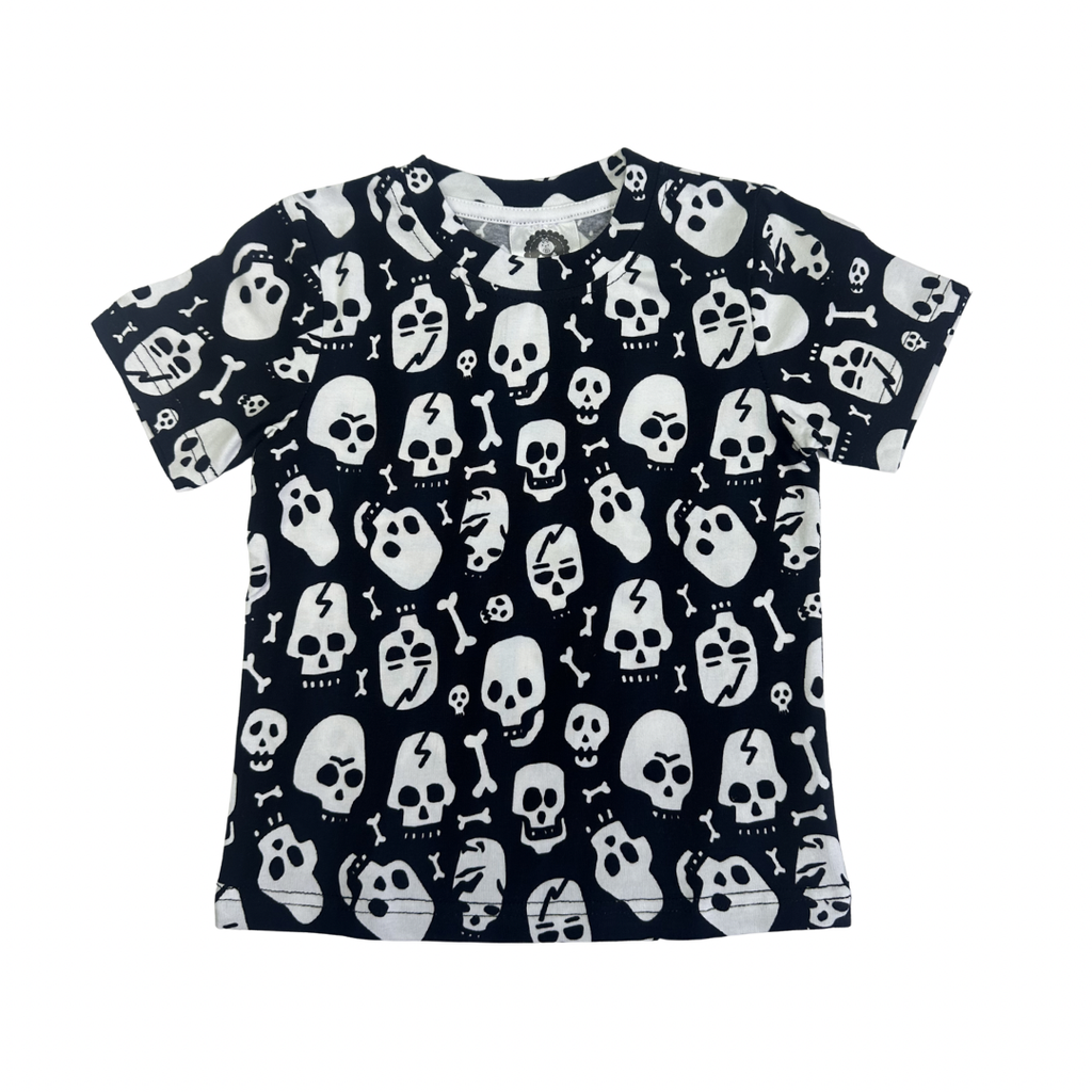 Black and white cotton t-shirt for toddlers featuring an all-over skull and bone print pattern.