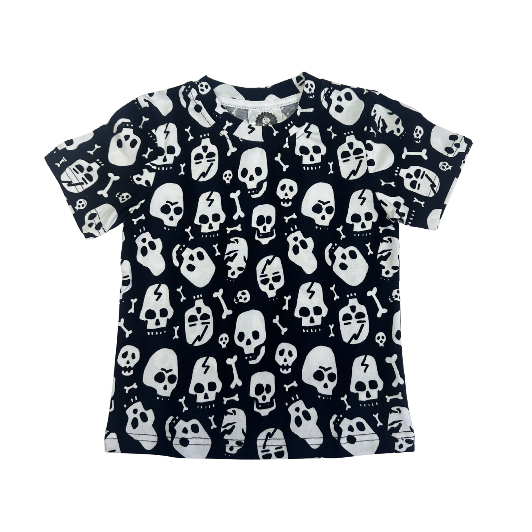 Black and white cotton t-shirt for toddlers featuring an all-over skull and bone print pattern.