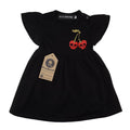 Black cotton girls' dress featuring red skull cherry print, flutter sleeves, and shoulder popper fastenings.