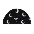 Soft black cotton baby hat featuring a white moon and star print with a folded brim design.