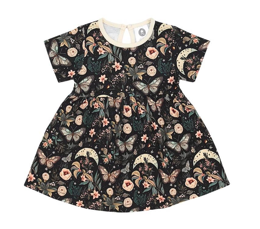 Short-sleeve cotton girls' dress in black with a whimsical butterfly, crescent moon, and floral print.